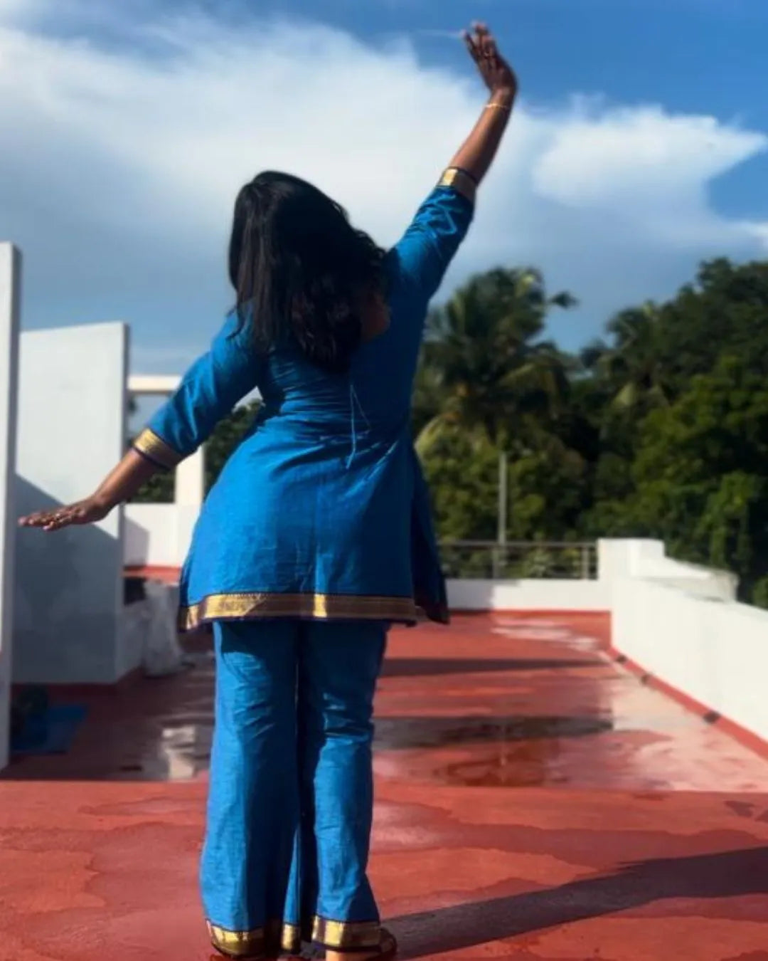 Model wearing a blue co-ord set from The Label Razi