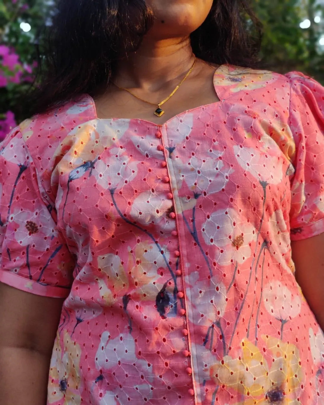 Model wearing a pastel checked dress from The Label Razi